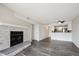 Open-concept living space with a cozy stone fireplace that leads to a modern kitchen with a breakfast bar at 4273 S Salida Way # 1, Aurora, CO 80013