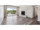 Bright living room with a cozy stone fireplace and large sliding glass door with natural light at 4273 S Salida Way # 1, Aurora, CO 80013