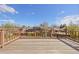 Picture of a raised, wooden back deck with a railing overlooking the yard at 7140 S Reed Ct, Littleton, CO 80128