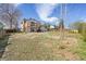 Wide angle view of the back yard with the house, deck, and patio in the background at 7140 S Reed Ct, Littleton, CO 80128