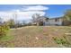 Large backyard features a deck attached to the house, perfect for outdoor entertaining at 7140 S Reed Ct, Littleton, CO 80128