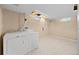 Laundry room with a set of washer and dryer and a window at 7140 S Reed Ct, Littleton, CO 80128