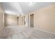 Neutral bedroom features soft carpet, ample closet space, and natural light at 7140 S Reed Ct, Littleton, CO 80128