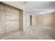 Spacious bedroom with wall-to-wall carpet and a walk-in closet is move-in ready at 7140 S Reed Ct, Littleton, CO 80128