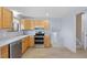 Updated kitchen features stainless steel appliances and modern cabinetry at 7140 S Reed Ct, Littleton, CO 80128