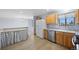 Well-equipped kitchen with stainless steel appliances and view into dining area at 7140 S Reed Ct, Littleton, CO 80128