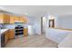 Modern kitchen features stainless steel appliances and ample cabinet space at 7140 S Reed Ct, Littleton, CO 80128