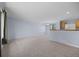 Open-concept living room with a dining area and a modern kitchen island at 7140 S Reed Ct, Littleton, CO 80128