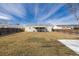 Large backyard with a well-maintained lawn, enclosed by a wooden fence, offering a private outdoor space at 1882 S Stuart St, Denver, CO 80219