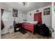 Bedroom with wood floors, a bed, black beanbag chair and decorative Halloween decor at 1882 S Stuart St, Denver, CO 80219