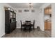 Cozy dining area with wood floors, a black dining set, and a hutch at 1882 S Stuart St, Denver, CO 80219