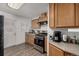 Charming kitchen with wood cabinets, stainless steel appliances, and durable countertops at 1882 S Stuart St, Denver, CO 80219