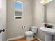 Powder room featuring pedestal sink and modern fixtures and lighting at 41 Garner Ln, Erie, CO 80516