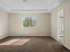 This large bedroom features an en-suite bathroom, natural light, and neutral paint, ready for your personalization at 41 Garner Ln, Erie, CO 80516