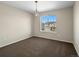 This spare bedroom offers a great window with neighborhood views, and features neutral paint to make it your own at 41 Garner Ln, Erie, CO 80516
