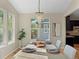 Dining area with chandelier and view of the backyard through ample windows at 41 Garner Ln, Erie, CO 80516