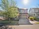 Charming two-story home with stone accents, a spacious two-car garage, and a well-maintained lawn at 41 Garner Ln, Erie, CO 80516