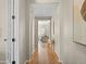 Inviting hallway with hardwood floors and neutral paint at 41 Garner Ln, Erie, CO 80516