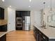 Open kitchen featuring stainless steel appliances, dark cabinets, and granite counters at 41 Garner Ln, Erie, CO 80516