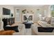 Cozy living room featuring a fireplace, neutral furniture, and an area rug at 41 Garner Ln, Erie, CO 80516
