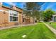 Exterior view of property featuring green grass, rock landscaping, and private yard at 11705 W Stanford Ln, Morrison, CO 80465