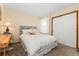 Cozy bedroom featuring a comfy bed, a side desk and ample closet space at 11705 W Stanford Ln, Morrison, CO 80465