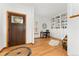 Inviting entryway features hardwood floors, natural light, and custom built-in shelving for a warm welcome at 11705 W Stanford Ln, Morrison, CO 80465
