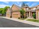 Inviting exterior showcasing the warm, neutral palette, complemented by a stone accent and well-kept landscaping at 11705 W Stanford Ln, Morrison, CO 80465