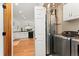View of the kitchen and laundry area, featuring modern appliances and cabinetry at 11705 W Stanford Ln, Morrison, CO 80465