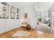 Bright living area with custom built-in shelving and open layout seamlessly blending comfort and style at 11705 W Stanford Ln, Morrison, CO 80465