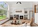 Bright living room featuring a fireplace, large windows, and vaulted ceilings at 11705 W Stanford Ln, Morrison, CO 80465