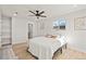 Bright bedroom featuring hardwood floors, a ceiling fan, and lots of natural light at 8217 W 71St Pl, Arvada, CO 80004