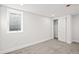 Carpeted bedroom with a window and closet offers plenty of storage at 8217 W 71St Pl, Arvada, CO 80004