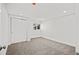 Bright carpeted bedroom with a closet and a window offering natural light at 8217 W 71St Pl, Arvada, CO 80004