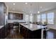 Gourmet kitchen features a large island and stainless steel appliances at 8760 Ginkgo Loop, Parker, CO 80134