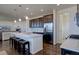 Modern kitchen with granite countertops and stainless steel appliances at 8760 Ginkgo Loop, Parker, CO 80134