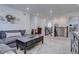 Upstairs living area with comfortable seating, neutral walls, and an overlook of the stairs at 8760 Ginkgo Loop, Parker, CO 80134