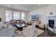 Bright living room with hardwood floors and a fireplace at 8760 Ginkgo Loop, Parker, CO 80134