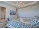 View of the main bedroom focusing on the queen sized bed, dresser, and en-suite bathroom access at 8760 Ginkgo Loop, Parker, CO 80134