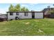 Well maintained backyard with a spacious lawn, perfect for outdoor activities and relaxation at 251 Norse St, Golden, CO 80401
