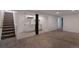 Open basement featuring a wet bar, carpeted flooring, and a staircase at 251 Norse St, Golden, CO 80401