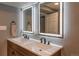 Bathroom featuring double sinks, modern mirrors, and updated fixtures at 251 Norse St, Golden, CO 80401