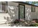 Close up of front entrance of home with fresh paint and potted plants at 251 Norse St, Golden, CO 80401