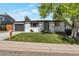 Charming single-story home with well-manicured lawn, garden, and a one car garage at 251 Norse St, Golden, CO 80401