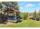 Charming gazebo nestled in a serene backyard setting, providing a tranquil retreat with scenic views at 251 Norse St, Golden, CO 80401