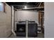 Unfinished basement laundry room with updated washer and dryer units at 251 Norse St, Golden, CO 80401