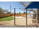 Spacious backyard featuring a gravel area, patio with seating, shed, and wooden fence at 851 Quitman St, Denver, CO 80204