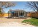 This gravel and grassy backyard is perfect for entertaining with a patio and outdoor seating at 851 Quitman St, Denver, CO 80204