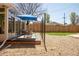 The backyard features a patio, a gravel area and a well manicured lawn at 851 Quitman St, Denver, CO 80204