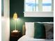 Bedroom featuring a gold lamp on a wooden nightstand at 851 Quitman St, Denver, CO 80204